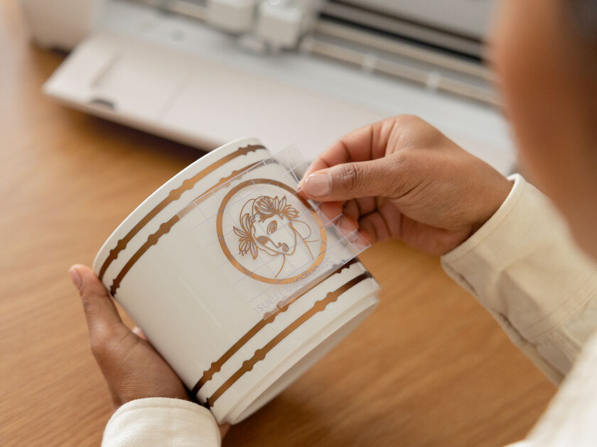 Woman's hands transferring vinyl 